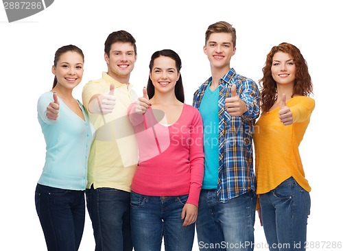Image of group of smiling teenagers showing thumbs up