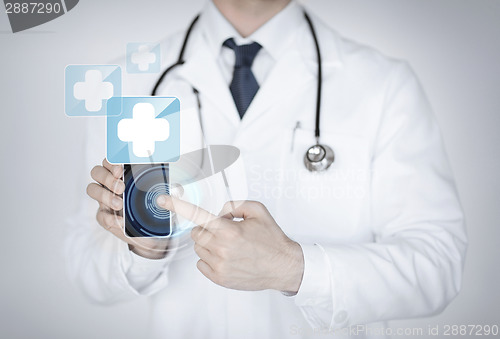 Image of doctor holding smartphone with medical app