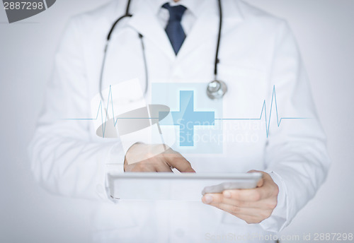 Image of male doctor holding tablet pc with medical app