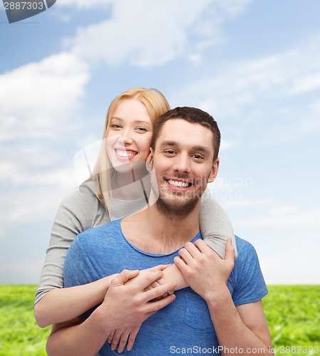 Image of smiling couple hugging