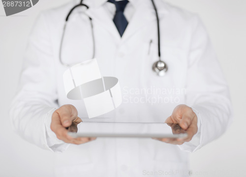 Image of male doctor holding tablet pc and stethoscope