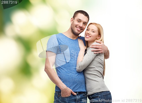 Image of smiling couple hugging