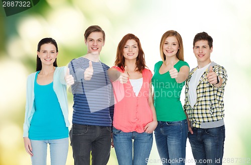 Image of group of smiling students showing thumbs up