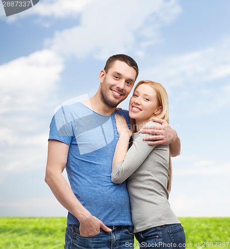 Image of smiling couple hugging