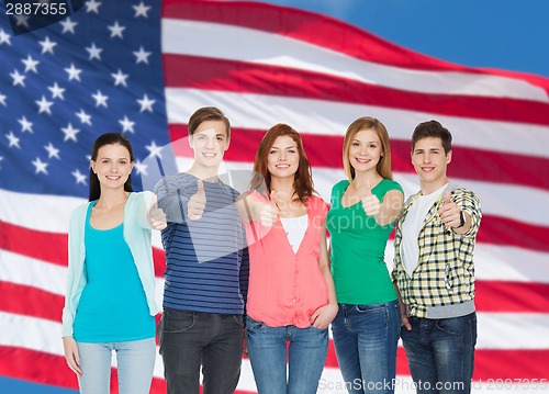 Image of group of smiling students showing thumbs up