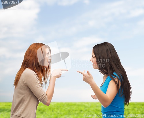 Image of two teenagers having a fight