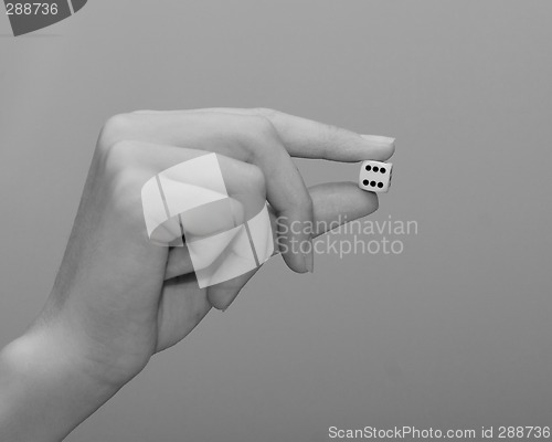 Image of woman holding dice
