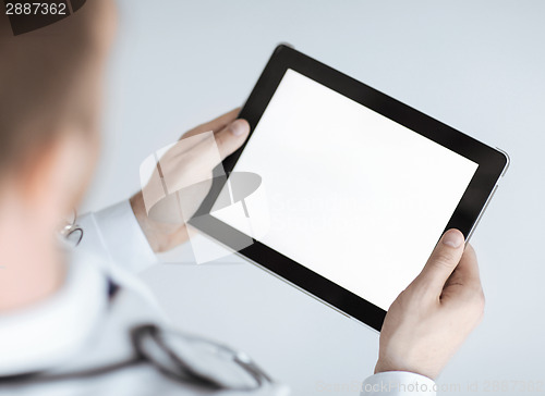 Image of male doctor holding tablet pc