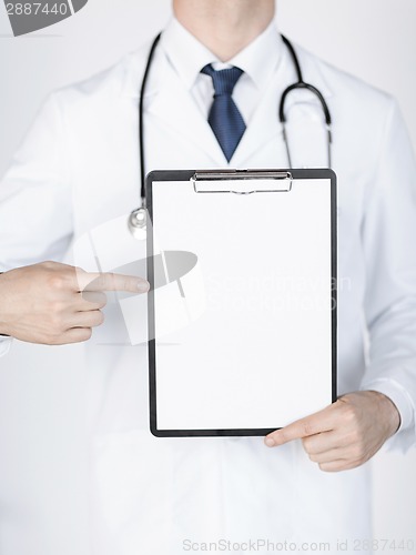 Image of doctor pointing at blank white paper