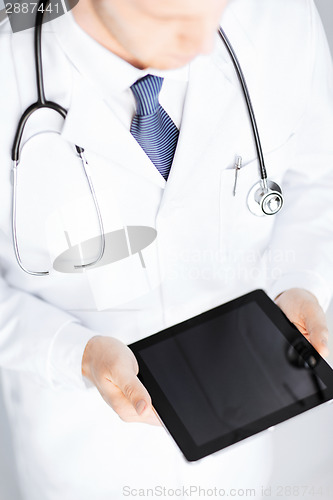 Image of male doctor holding tablet pc