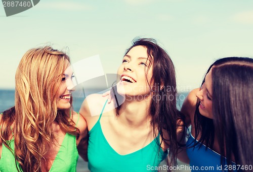 Image of girls walking on the beach