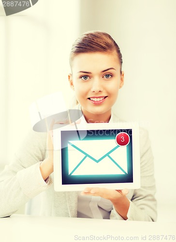 Image of businesswoman with tablet pc in office