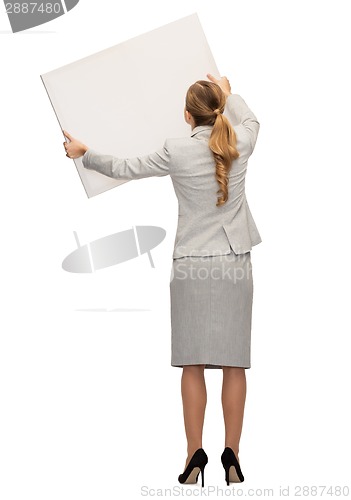 Image of businesswoman or teacher in suit from back