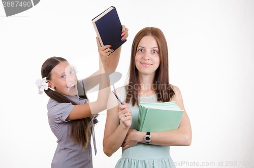 Image of Trainee teacher has a textbook