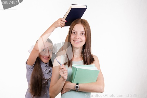 Image of Trainee teacher has a textbook