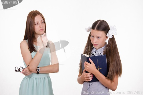 Image of The teacher shakes his finger at the student