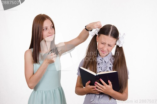 Image of Teacher student knocks on the head