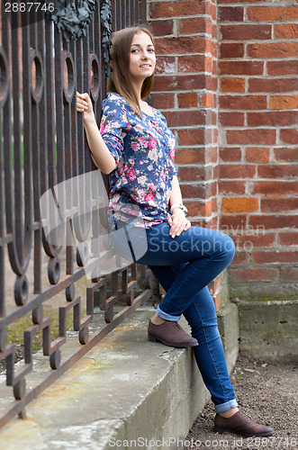 Image of Full-length portrait of a pensive girl.