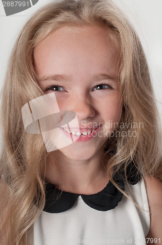 Image of Adorable little girl in white