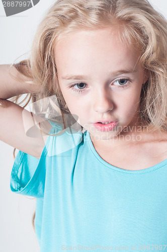 Image of Adorable little girl in blue