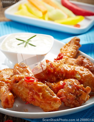 Image of fried chicken wings with sweet chili sauce