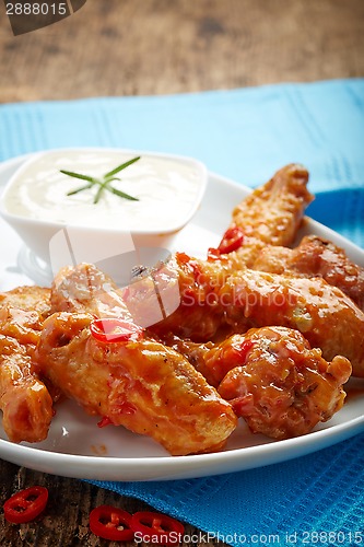 Image of fried chicken wings with sweet chili sauce