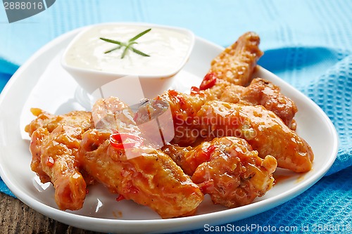 Image of fried chicken wings with sweet chili sauce