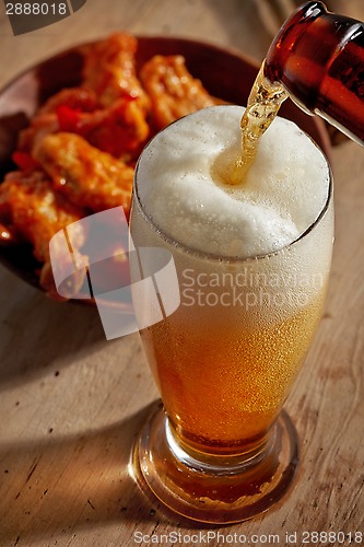 Image of beer pouring into glass