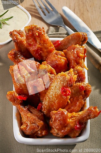 Image of fried chicken wings with sweet chili sauce