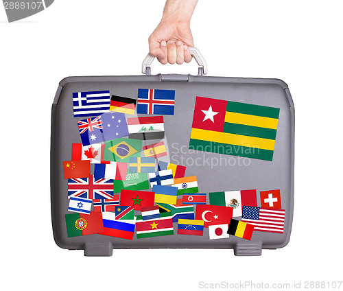 Image of Used plastic suitcase with stickers