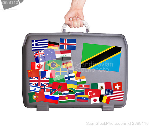 Image of Used plastic suitcase with stickers