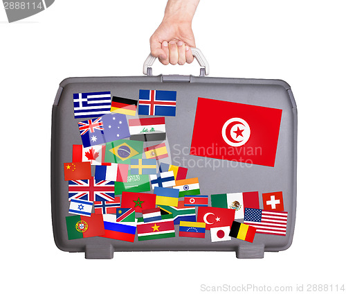 Image of Used plastic suitcase with stickers
