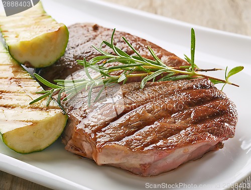 Image of grilled beef steak and zucchini