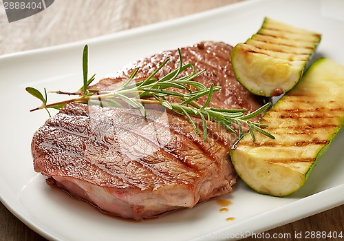Image of grilled beef steak and zucchini
