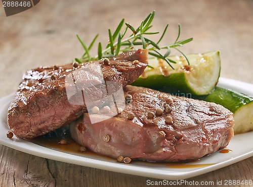 Image of grilled beef steak on white plate