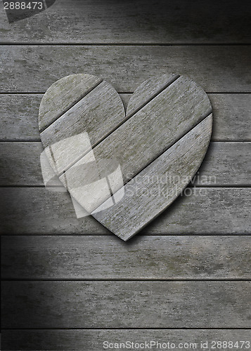 Image of Gray weathered wood heart on wooden background