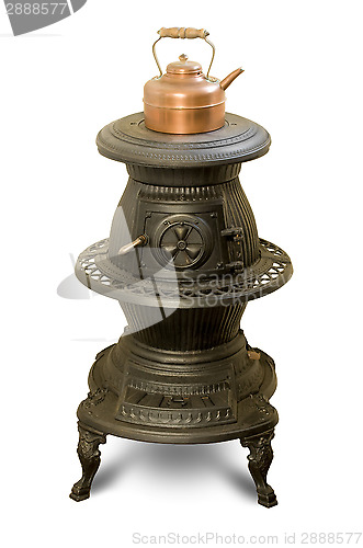 Image of Antique iron wood-burning stove with copper kettle