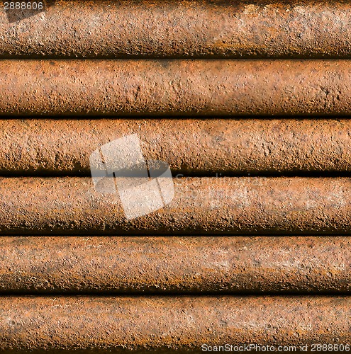 Image of Horizontal rusty pipe background seamlessly tileable