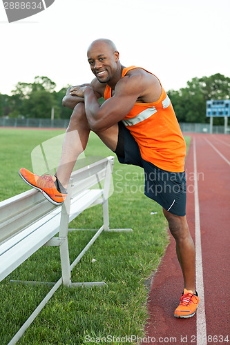 Image of Track Runner Stretching