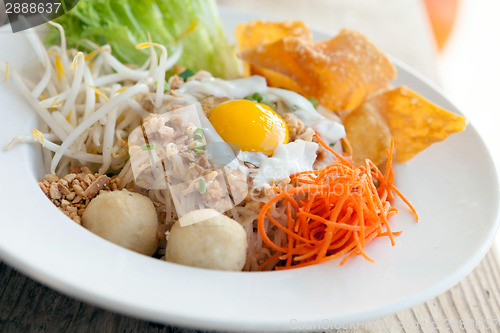 Image of Thai Noodle Dish with Fried Egg