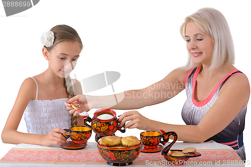 Image of Mother and daughter drinking tea