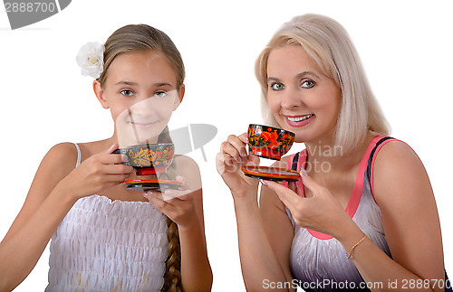 Image of Mother and daughter drinking tea