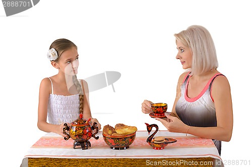 Image of Mother and daughter drinking tea