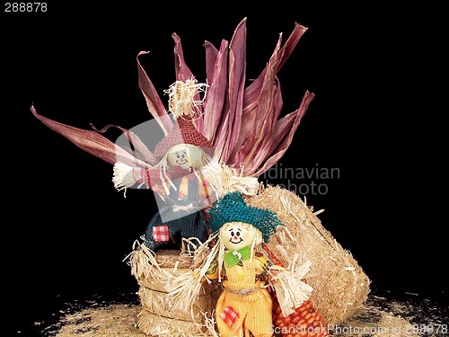 Image of Scarecrows with Hay and Corn