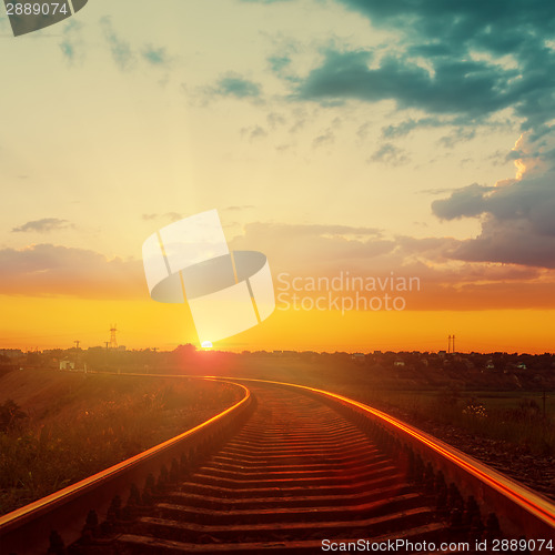 Image of good orange sunset over railroad to horizon