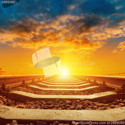 Image of beautiful orange sunset over railroad close up