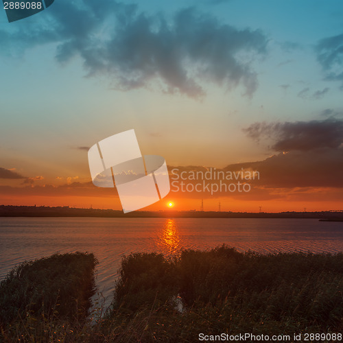 Image of orange sunset over river