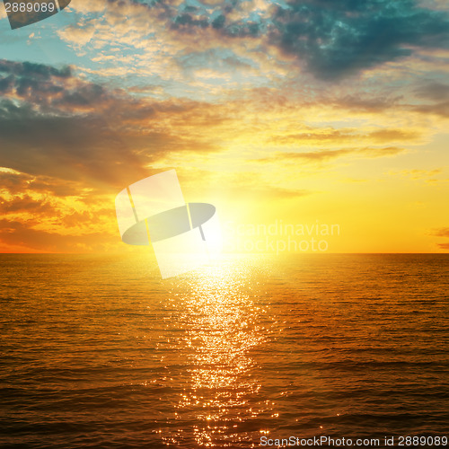 Image of bright orange sunset over sea