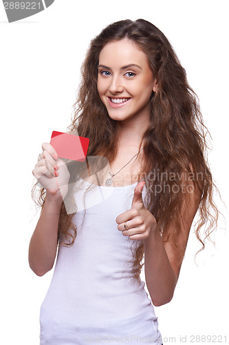 Image of Playful woman showing blank credit card