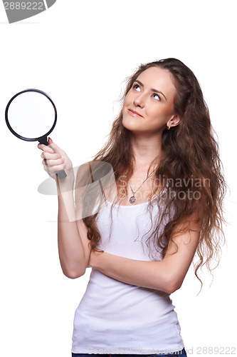 Image of Smiling woman with magnifying glass looking up